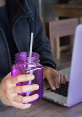 Drinking water on hand of working woman