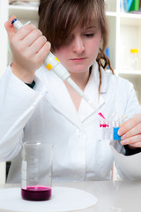 Young scientist loads samples