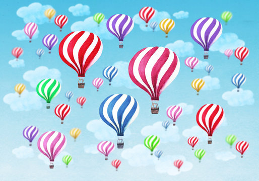 Hot air balloons with clouds on blue sky background