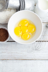 ingredients for baking cakes on a white background top view