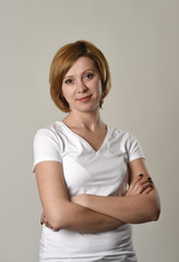 young beautiful red hair woman smiling happy and cheerful in friendly joyful face expression