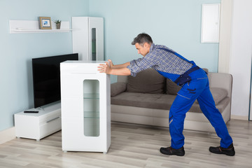 Mover Placing Furniture At Home