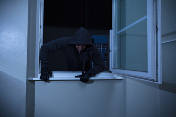 Burglar Entering Through The Window