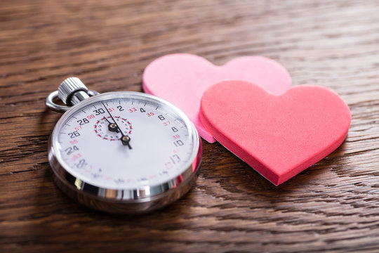 Speed Dating Concept. Hearts And A Stop Watch