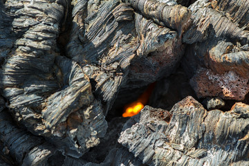 Fire at the crack of frozen lava field at Tolbachik volcano, after eruption in 2012, Klyuchevskaya Group of Volcanoes