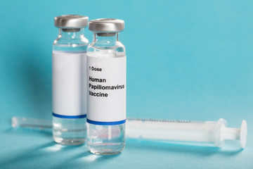 Human Papillomavirus Vaccine In Bottles With Syringe
