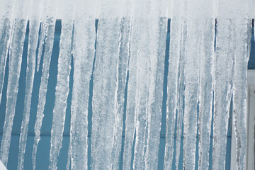close up on icicle hanging on the roof