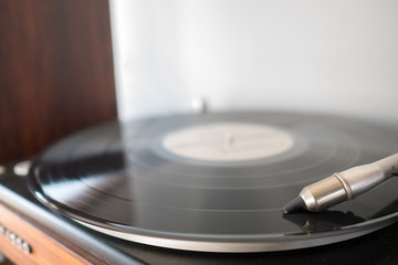 turntable, black vinyl playing tracks on record player