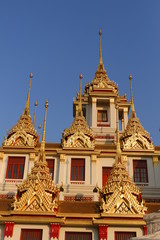 Fototapeta premium Wat Ratchanatdaram ,Lohaprasat in Wat Ratchanatdaram Worawihan, beautiful temple view to skyline in Bangkok, Thailand