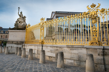Golden fence and sculpture at Versailles Palace