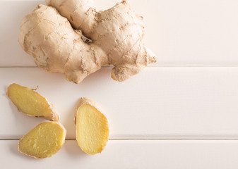 Ginger on white wooden background