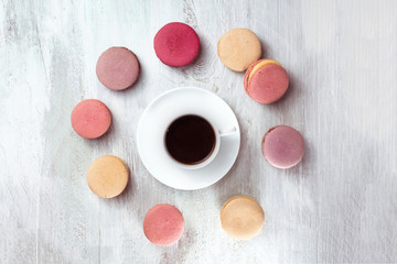Black coffee with macarons, overhead shot