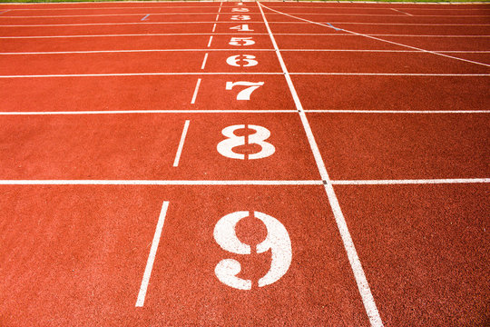 Red running track number background.