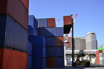 Fototapeta premium Toplifter handling cargo container loading to container trailer in import export logistic zone 