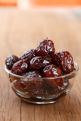 red date syrup product in bowl on wood front view
