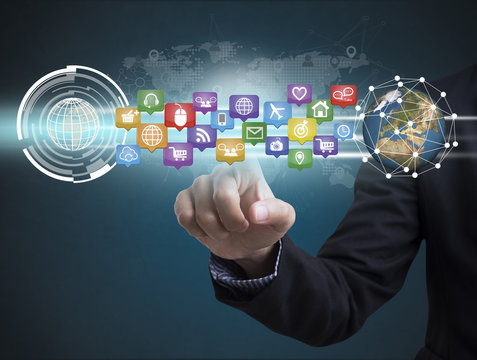 Business hand with application icons interface and globe networking system. concept technology social network communication.