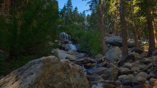 MoCo Timelapse of Alpine Waterfalls in Morning Sun -Tilt Down-