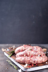 Raw sausages with spice