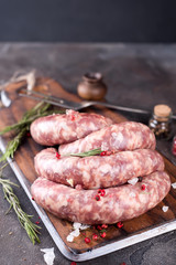 Raw sausages with spice