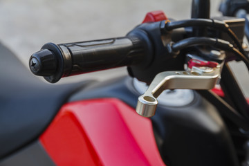 Close up of racing motorcycle handlebar and brake lever.
