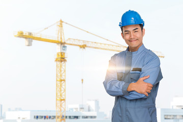 Portrait of engineer wear blue helmet saefty on construction site with crane background