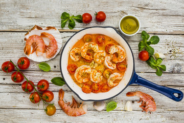 Fried shrimp with tomatoes and garlic. Mediterranean and Italian food. 