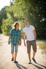 Son spending priceless time with his mother as they walk together