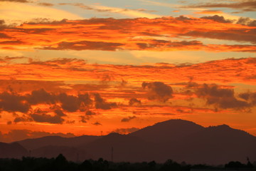 sky in sunset  and motion cloud,  beautiful colorful  twilight  time with mountain silhouette