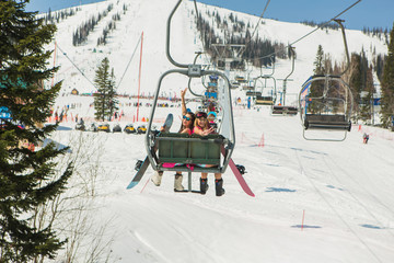 Naklejka premium Two girls on a ski-lift