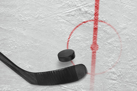Fragment of ice hockey rink with a stick and puck