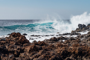 Rough rocky coast and stormy ocean water