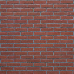 square part of red brick wall