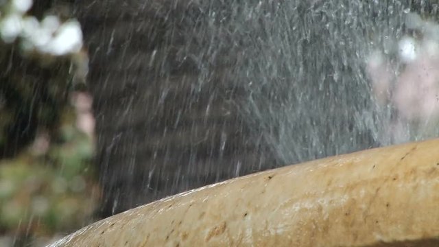 Details of water splashing on a fountain in Jardines de la Alameda Marqu&eacute;s de Comillas in Cadiz Spain