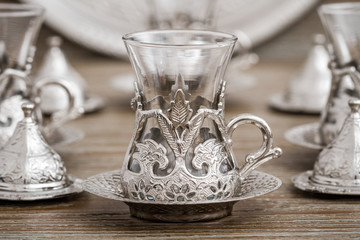 Traditional Silver Coffee Cup Set in a Tray on Wooden Background
