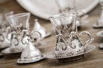 Traditional Silver Coffee Cup Set in a Tray on Wooden Background