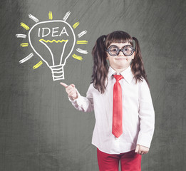 Little genius girl having an idea. Education, innovation and creativity concept