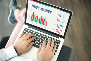 Business Charts and Graphs on screen with SAVE MONEY title