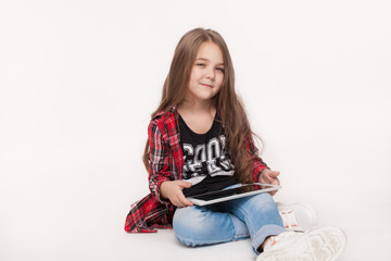 little student girl with tablet pc doing homework