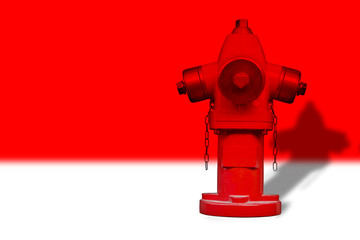Red hydrant on red background - image with copy space