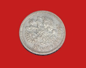 old Russian silver coin 50 kopecks 1899 in the isolation of a red background