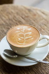 Coffee cup top view on old wooden