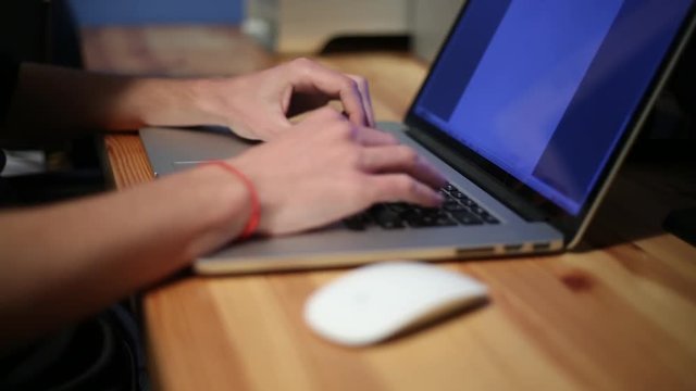 Businessman hands typing on a laptop keyboard,  working with NoteBook in the desk office -Dan
