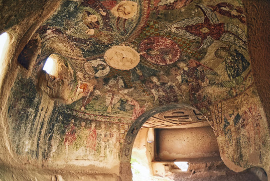 Cappadocia ,Turkey - October 20 ,2016 : Wall art of old frescoes in the  Church , Goreme