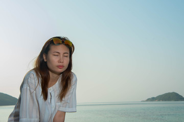 young woman happy on the beach