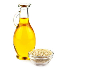 Sesame oil in bottle and sesame seeds