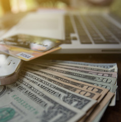 Mobile phone and US dollar with notebook and creditcards. Concept of payment and savings