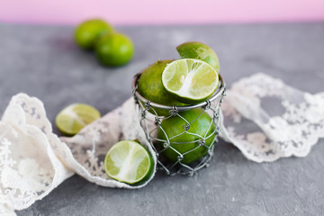 Limes from Thailand on a gray background