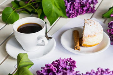 White coffee cup with donats at the morning breakfast