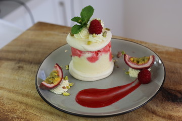 French dessert: ice cream, meringue and rasberry coulis - vacherin dessert