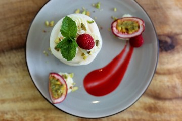 French dessert: ice cream, meringue and rasberry coulis - vacherin dessert